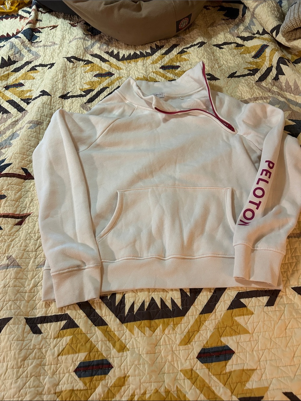 Peloton Cream Crewneck Pullover with pink Zip and Sleeve Logo